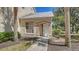 Charming front entrance with a pathway, window, and neatly landscaped surroundings at 7687 Sweetbay Cir # 7687, Bradenton, FL 34203