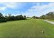 Scenic golf course view featuring lush green fairway and mature trees on a sunny day at 7687 Sweetbay Cir # 7687, Bradenton, FL 34203