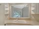 Bright kitchen showcases a view into a vaulted great room with a modern sink and light countertops at 7687 Sweetbay Cir # 7687, Bradenton, FL 34203