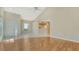 Bright living room with vaulted ceilings, tile entryway, and wood laminate floors at 7687 Sweetbay Cir # 7687, Bradenton, FL 34203