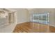 Bright living room featuring wood floors, natural light, and a view of the outdoors at 7687 Sweetbay Cir # 7687, Bradenton, FL 34203