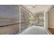 Enclosed patio with woven shades, ceiling fan and tiled flooring offering views of the outdoors at 7687 Sweetbay Cir # 7687, Bradenton, FL 34203