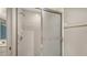 Clean, well-maintained shower features white tiles, a frosted glass door, and convenient grab bar at 7687 Sweetbay Cir # 7687, Bradenton, FL 34203