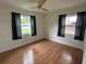 A bedroom featuring wood floors, natural light, and a fresh and inviting atmosphere at 775 Liberty St, Englewood, FL 34223