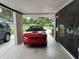 Carport featuring a red sports car, providing sheltered parking for vehicles at 775 Liberty St, Englewood, FL 34223