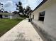 Property's exterior showing driveway, lawn, and building, highlighting the home's curb appeal at 775 Liberty St, Englewood, FL 34223