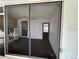 Cozy sunroom featuring natural light, carpet floors, and access to the outdoors at 775 Liberty St, Englewood, FL 34223