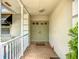Inviting covered front entry with double doors and a welcoming 'HOME' mat at 7810 San Juan Ave, Bradenton, FL 34209