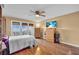 Spacious bedroom featuring hardwood floors, a ceiling fan, and a view of the ocean at 835 S Osprey Ave # 415, Sarasota, FL 34236