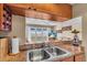 Open kitchen view into living area, featuring stainless steel sink, counter space, and decor at 835 S Osprey Ave # 415, Sarasota, FL 34236