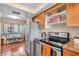 Bright kitchen with stainless steel appliances, tile floors, and a table and chairs for dining at 835 S Osprey Ave # 415, Sarasota, FL 34236