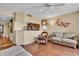 Inviting living area with hardwood floors, comfy seating, and open layout to the kitchen at 835 S Osprey Ave # 415, Sarasota, FL 34236