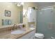 Bathroom featuring a shower with glass doors, granite countertops, and a single sink at 8402 Princess Ct, Palmetto, FL 34221