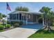Charming single Gathering home features a covered carport, front patio, and meticulously maintained landscaping at 8402 Princess Ct, Palmetto, FL 34221