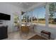 Bright Florida room with tiled floor, wicker furniture, and views of the outdoors at 8402 Princess Ct, Palmetto, FL 34221