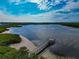 A scenic view of the area featuring a wooden pier and waterfront access at 859 Audubon Dr # 859, Bradenton, FL 34209