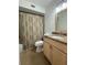 Bathroom featuring granite countertops and a wooden vanity, a mirror, and a shower with tub at 859 Audubon Dr # 859, Bradenton, FL 34209