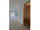 Bright bedroom featuring plush carpeting, a sliding glass door, large closet, and a ceiling fan at 859 Audubon Dr # 859, Bradenton, FL 34209