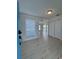 Bright entryway with wood-look floors, white walls, ample storage, and a glimpse of the water view at 859 Audubon Dr # 859, Bradenton, FL 34209