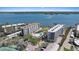 Aerial view of condos with a pool, parking, and waterfront access with beautiful views at 8735 Midnight Pass Rd # 306B, Sarasota, FL 34242