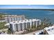 Aerial view of waterfront condos and boat docks at 8735 Midnight Pass Rd # 306B, Sarasota, FL 34242