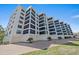 Exterior view highlighting the multiple windows, garage parking and well-maintained landscaping at 8735 Midnight Pass Rd # 306B, Sarasota, FL 34242