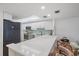 Bright kitchen features white quartz countertops, stainless appliances and a light backsplash at 8735 Midnight Pass Rd # 306B, Sarasota, FL 34242