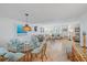 Open concept living and dining space with abundant natural light and neutral tones at 8735 Midnight Pass Rd # 306B, Sarasota, FL 34242