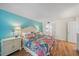 Main bedroom featuring hardwood floors, ensuite bathroom access and side-by-side nightstands at 8735 Midnight Pass Rd # 306B, Sarasota, FL 34242