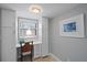 Office area features built-ins, a desk, natural light from the window, and neutral walls at 8735 Midnight Pass Rd # 306B, Sarasota, FL 34242