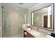 Modern bathroom featuring a glass shower and granite countertop vanity at 915 Seaside Dr # 613 Weeks 32-33, Sarasota, FL 34242