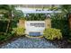 Elegant entrance to The Residences with lush landscaping, a water feature, and modern signage at 915 Seaside Dr # 613 Weeks 32-33, Sarasota, FL 34242