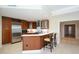 Modern kitchen with bar seating, wood cabinets, and white countertops at 915 Seaside Dr # 613 Weeks 32-33, Sarasota, FL 34242