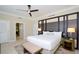 Spacious bedroom with a king-sized bed, decorative headboard, and access to the en-suite bathroom at 915 Seaside Dr # 613 Weeks 32-33, Sarasota, FL 34242