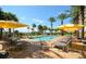 Inviting pool area with lounge chairs and umbrellas at 915 Seaside Dr # 613 Weeks 32-33, Sarasota, FL 34242