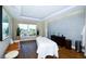 Relaxing spa room with natural light, hardwood floors, massage table, and serene decor at 915 Seaside Dr # 613 Weeks 32-33, Sarasota, FL 34242