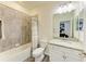 Bathroom with a bathtub and shower, vanity, and toilet at 10015 Marbella Dr, Bradenton, FL 34211