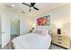 Bright bedroom with a plush bed, colorful wall art, and stylish nightstands at 10015 Marbella Dr, Bradenton, FL 34211