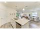 Open kitchen with granite counters overlooks the dining and living areas, providing seamless flow and a social atmosphere at 10015 Marbella Dr, Bradenton, FL 34211