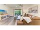 Bright living room offers comfortable seating, stylish decor, and sliding glass doors to the outdoor area at 10015 Marbella Dr, Bradenton, FL 34211