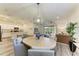 Open floor plan shows the kitchen, dining area, and living room for an airy and inviting living space at 10015 Marbella Dr, Bradenton, FL 34211
