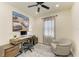 Office with ceiling fan, desk, and plush chair at 10015 Marbella Dr, Bradenton, FL 34211