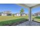 View of backyard featuring a manicured lawn and paved patio at 10054 Cross River Trl, Parrish, FL 34219