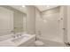 Bathroom featuring subway tiled shower with a large framed mirror and vanity at 10054 Cross River Trl, Parrish, FL 34219