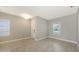 Spacious, neutral-toned bedroom features tile floors and two windows at 10054 Cross River Trl, Parrish, FL 34219