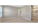Bedroom with neutral walls, plush carpet, and views to bathroom with dual sinks at 10054 Cross River Trl, Parrish, FL 34219