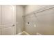 Laundry room with wire shelving, tile flooring and neutral painted walls at 10054 Cross River Trl, Parrish, FL 34219