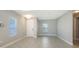 Inviting living room features tile floors, recessed lights, and plentiful natural light at 10054 Cross River Trl, Parrish, FL 34219