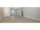 Spacious living room with tile floors, white baseboards, and a smooth ceiling at 10054 Cross River Trl, Parrish, FL 34219