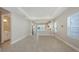 The main living area showcasing tile flooring, recessed lighting, and an open floor plan with kitchen access at 10054 Cross River Trl, Parrish, FL 34219